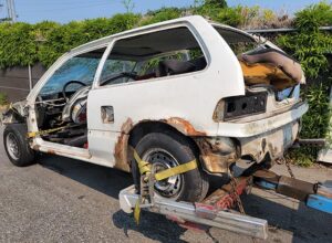 Surrey Scrap Cars towing a Honda Civic